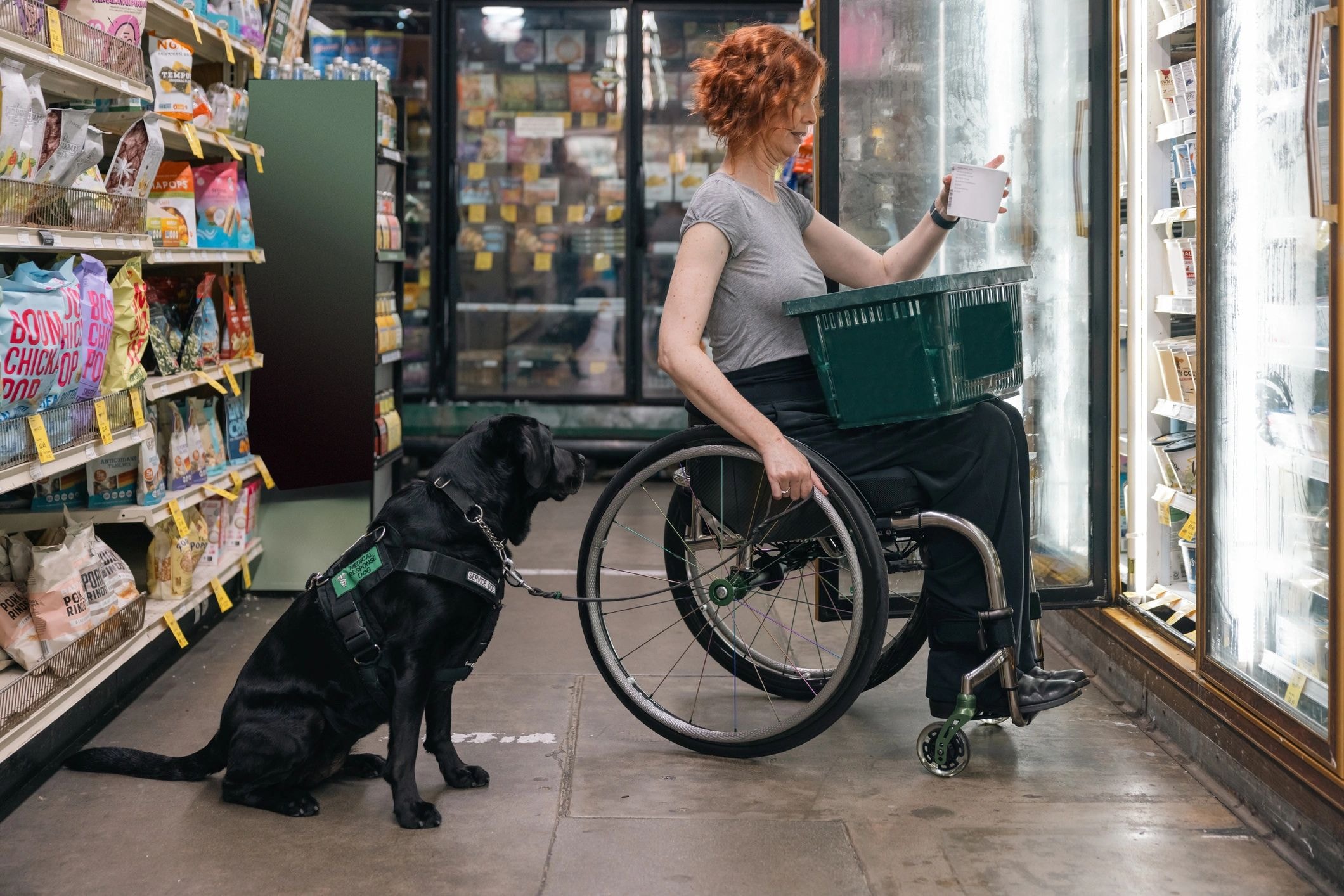 Service dog handler entering a retail store